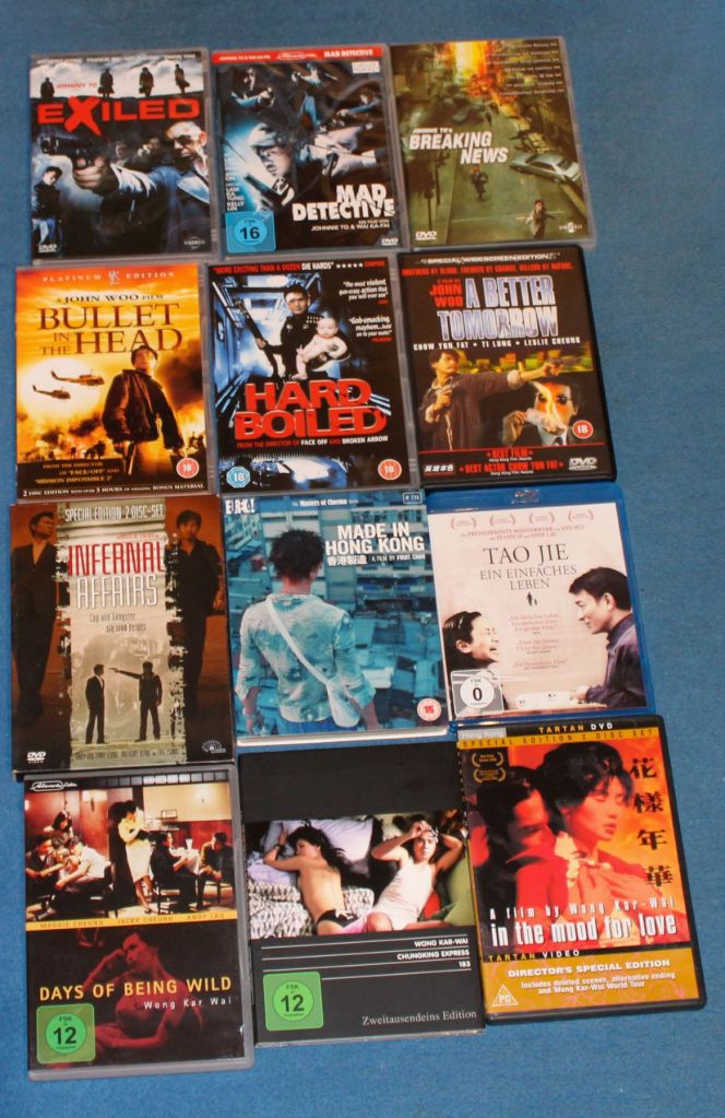 DVD-Cover zu je drei Filmen in einer Reihe, von oben rechts: Exiled, Mad Detective, Breaking News, Bullet in the Head, Hard Boiled, A Better Tomorrow, Infernal Affairs, Made in Hong Kong, Tao Jie, Days of Being Wild, Chungking Express und In the Mood for Love.